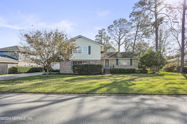 view of front of home featuring a garage and a front yard