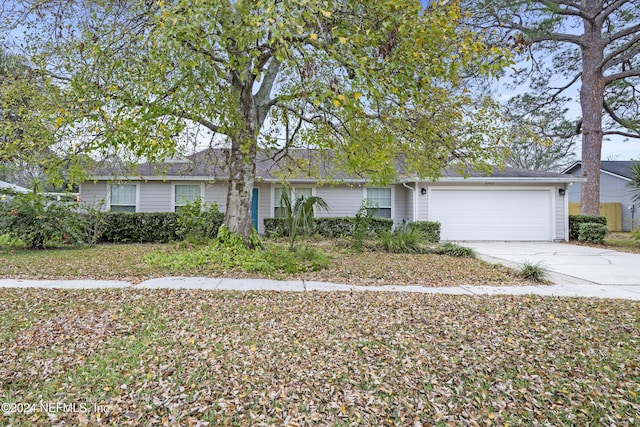 ranch-style house featuring a garage