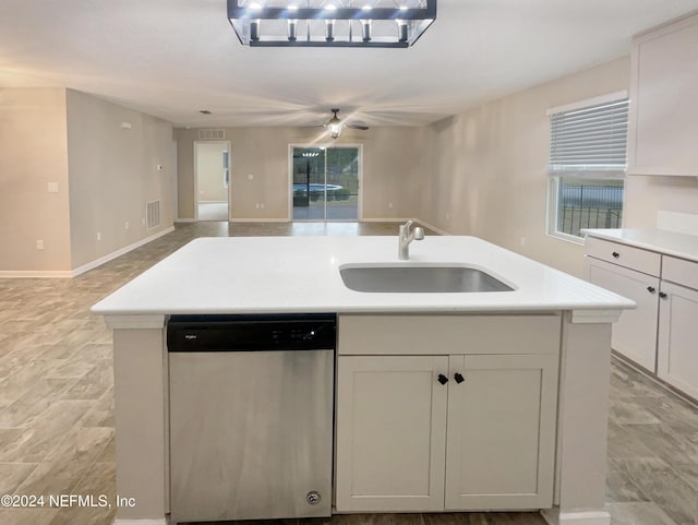 kitchen with white cabinets, dishwasher, sink, and a kitchen island with sink