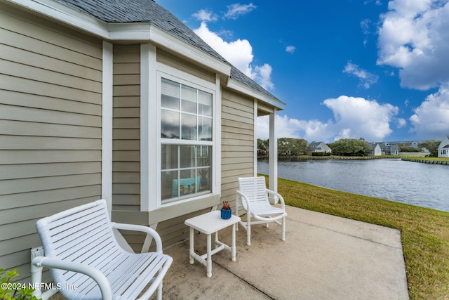 view of patio with a water view