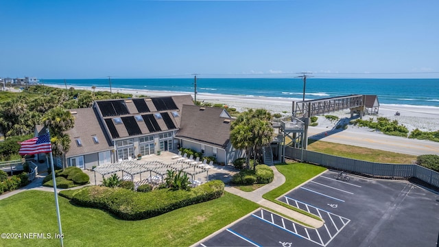 birds eye view of property featuring a water view and a view of the beach