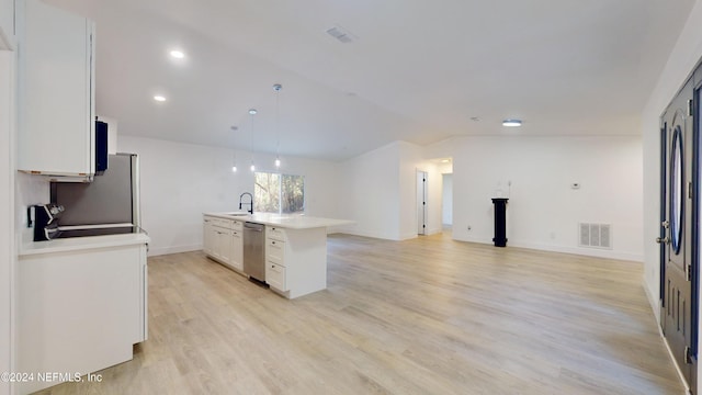 kitchen with lofted ceiling, decorative light fixtures, a center island with sink, stainless steel dishwasher, and white cabinets