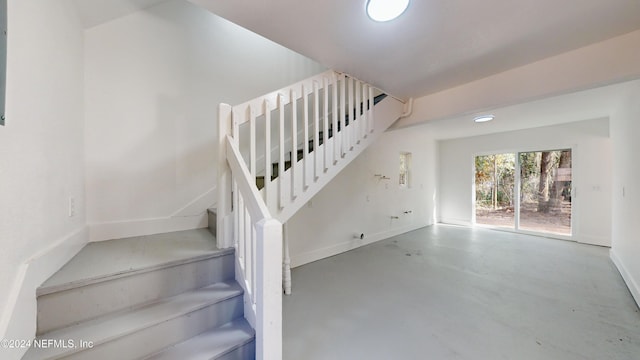 4774 Leopard Cir, Middleburg, FL 32068 - stairs with finished concrete floors and baseboards