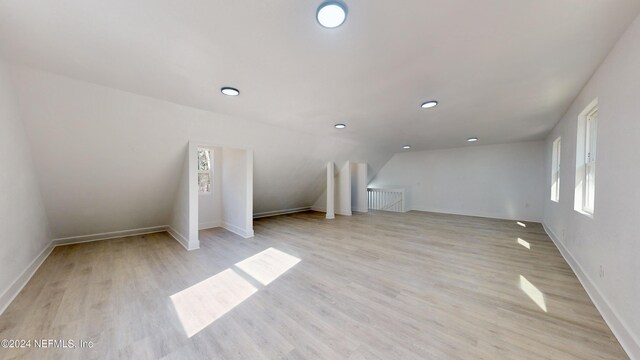 4774 Leopard Cir, Middleburg, FL 32068 - bonus room featuring light wood finished floors, healthy amount of natural light, lofted ceiling, and recessed lighting