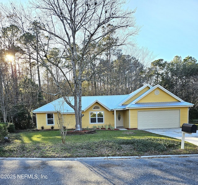 ranch-style house featuring a front yard and a garage