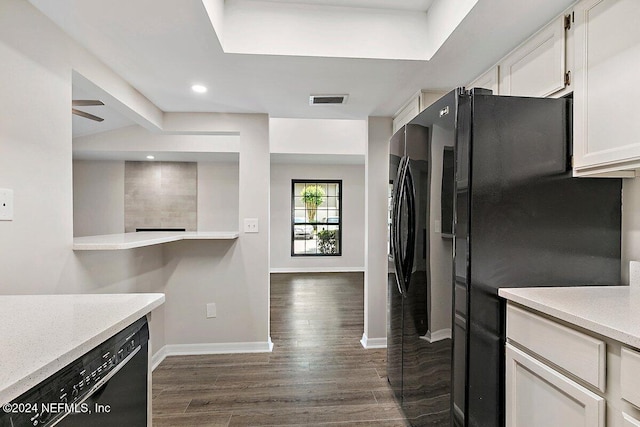 kitchen with dark hardwood / wood-style flooring, lofted ceiling with beams, black appliances, and white cabinets