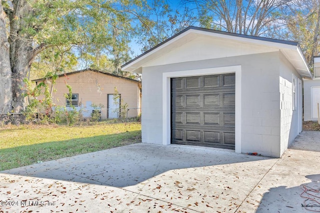 garage with a yard