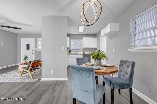 dining room with ceiling fan and light hardwood / wood-style floors