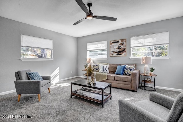 carpeted living room with a wealth of natural light and ceiling fan