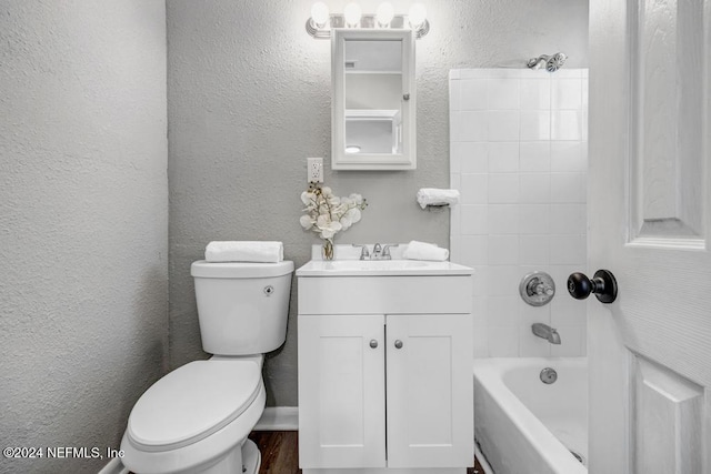 full bathroom with vanity, toilet, and tiled shower / bath