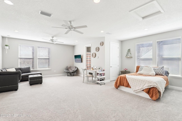 bedroom with light carpet, a textured ceiling, and ceiling fan