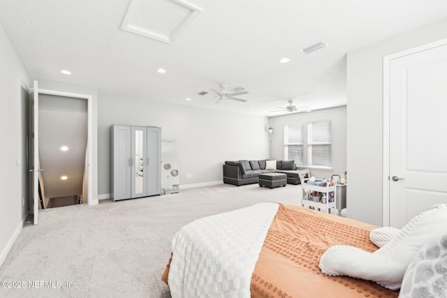 bedroom featuring a textured ceiling, carpet floors, and ceiling fan