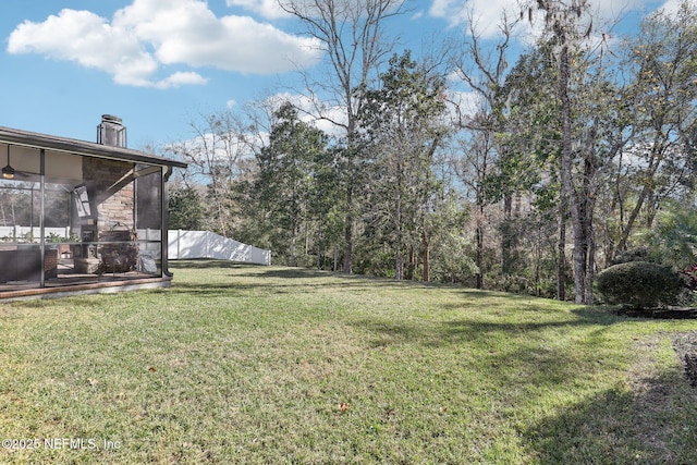 view of yard featuring a sunroom