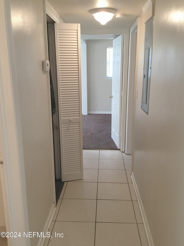 hallway featuring light tile patterned floors