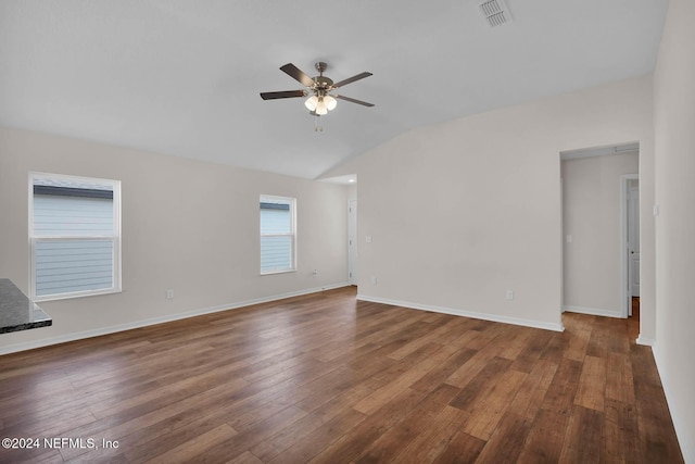 unfurnished room featuring dark hardwood / wood-style floors, ceiling fan, and lofted ceiling