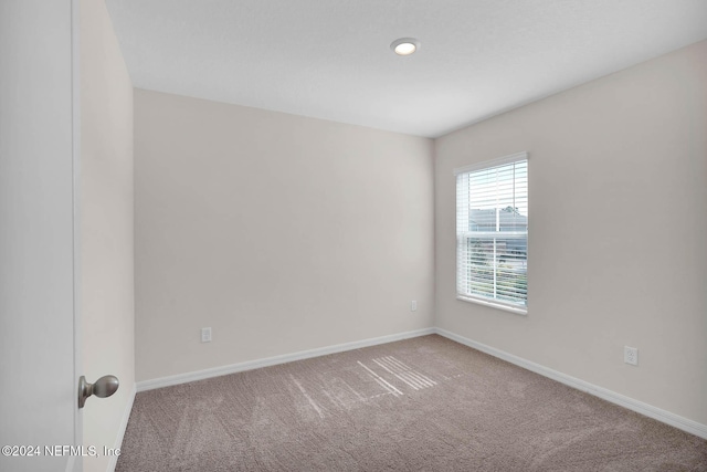 unfurnished room with carpet