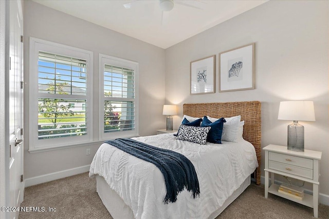 carpeted bedroom with ceiling fan