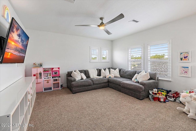 living room featuring carpet floors and ceiling fan