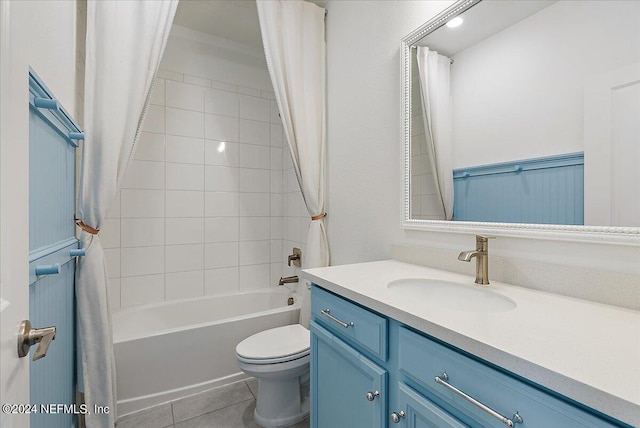 full bathroom featuring shower / tub combo with curtain, vanity, toilet, and tile patterned floors