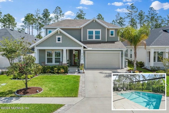 craftsman-style house with a garage and a front yard