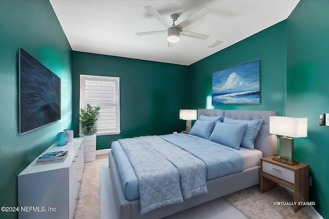 carpeted bedroom with ceiling fan