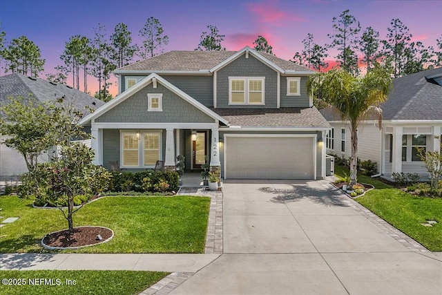 craftsman inspired home featuring a yard and a garage