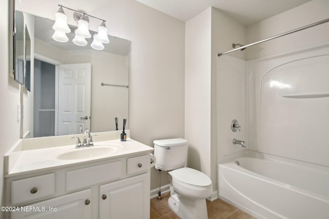 full bathroom with toilet, vanity, tile patterned floors, and tub / shower combination