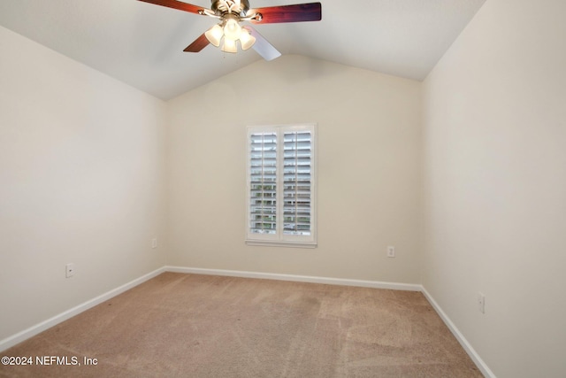 unfurnished room featuring carpet flooring, ceiling fan, and vaulted ceiling