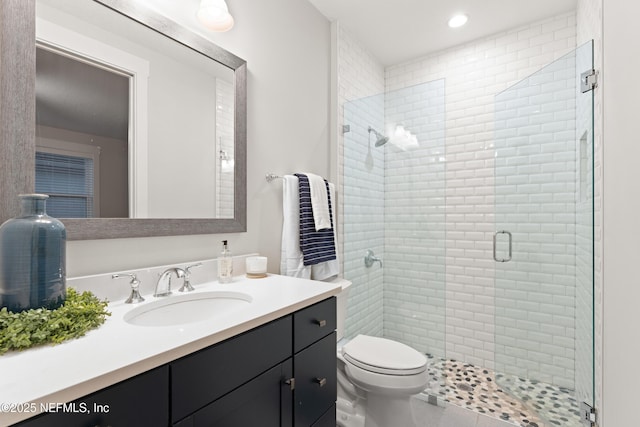full bathroom with a shower stall, toilet, recessed lighting, vanity, and tile patterned flooring