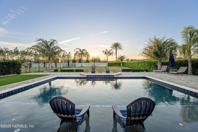 view of swimming pool with fence, a patio area, and a fenced in pool