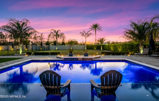 view of pool featuring a fenced backyard, a fenced in pool, and a patio area