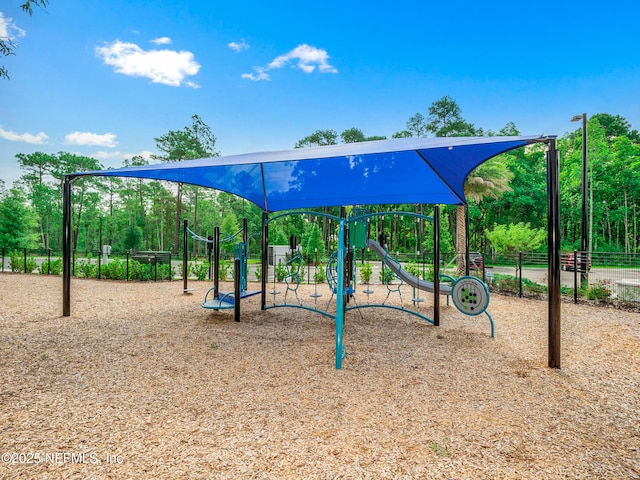 communal playground featuring fence