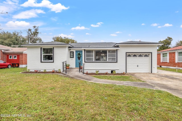 ranch-style home with a garage and a front lawn