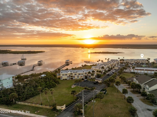 aerial view at dusk with a water view