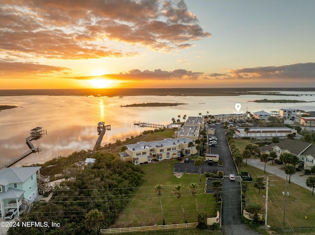 aerial view at dusk with a water view