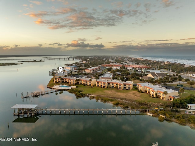 aerial view at dusk with a water view