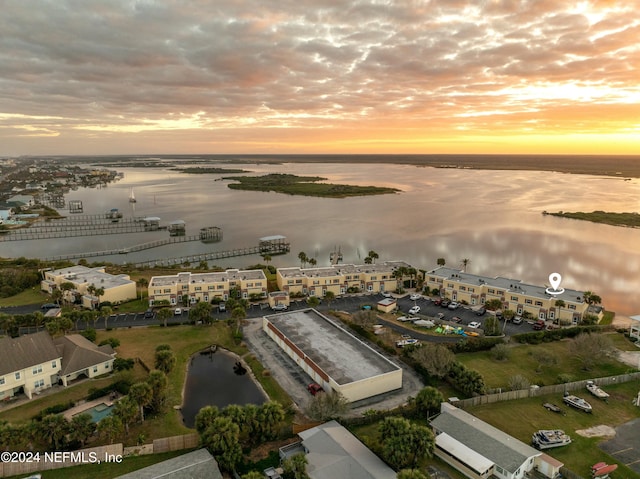 aerial view at dusk with a water view