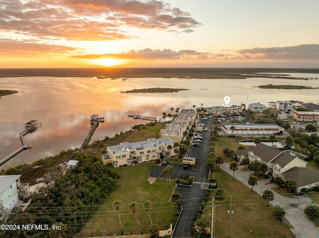 aerial view at dusk with a water view