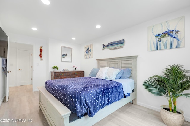 bedroom with light wood-type flooring