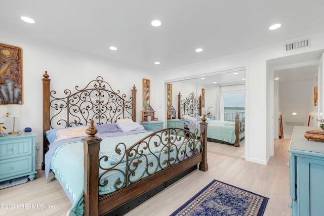 bedroom with light wood-type flooring