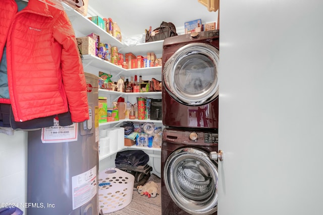 clothes washing area featuring stacked washer / drying machine