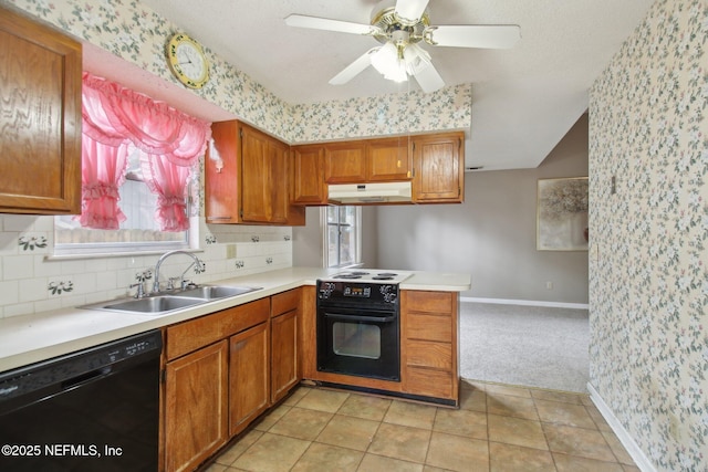 kitchen featuring kitchen peninsula, dishwasher, oven, ceiling fan, and sink