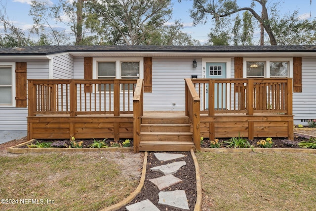 rear view of house with a lawn