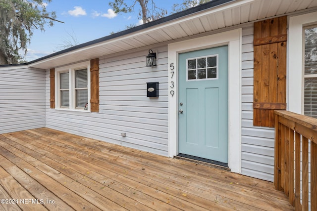 entrance to property featuring a deck