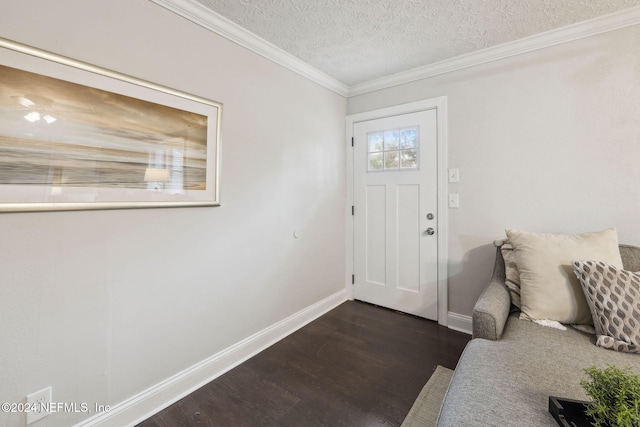 foyer featuring crown molding, dark hardwood / wood-style flooring, and a textured ceiling