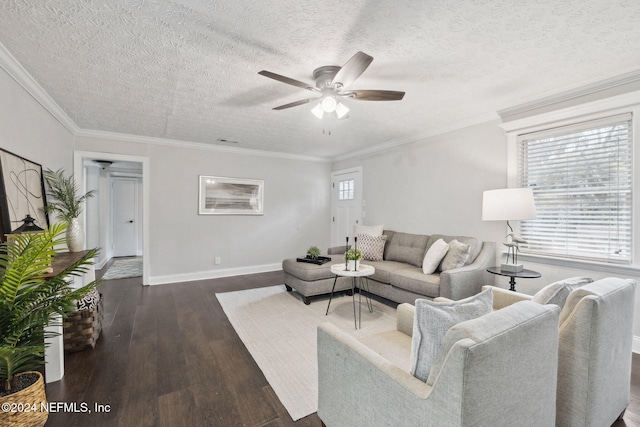 living room with a textured ceiling, dark wood-type flooring, ceiling fan, and ornamental molding