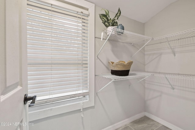 spacious closet featuring tile patterned floors