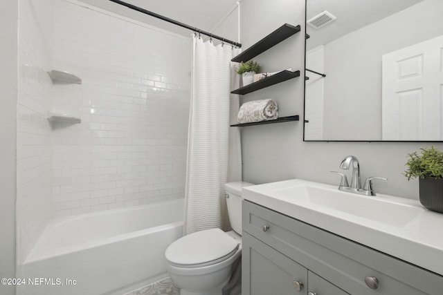 full bathroom with vanity, toilet, and shower / tub combo with curtain