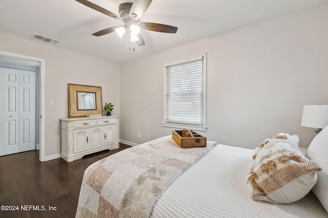 bedroom with ceiling fan and dark hardwood / wood-style floors