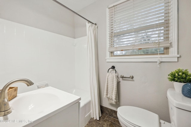 full bathroom with sink, shower / bathtub combination with curtain, and toilet